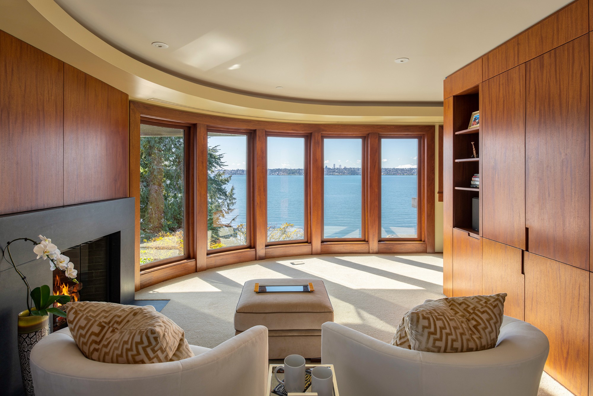 Mahogany kitchen filled with afternoon glass-wall light