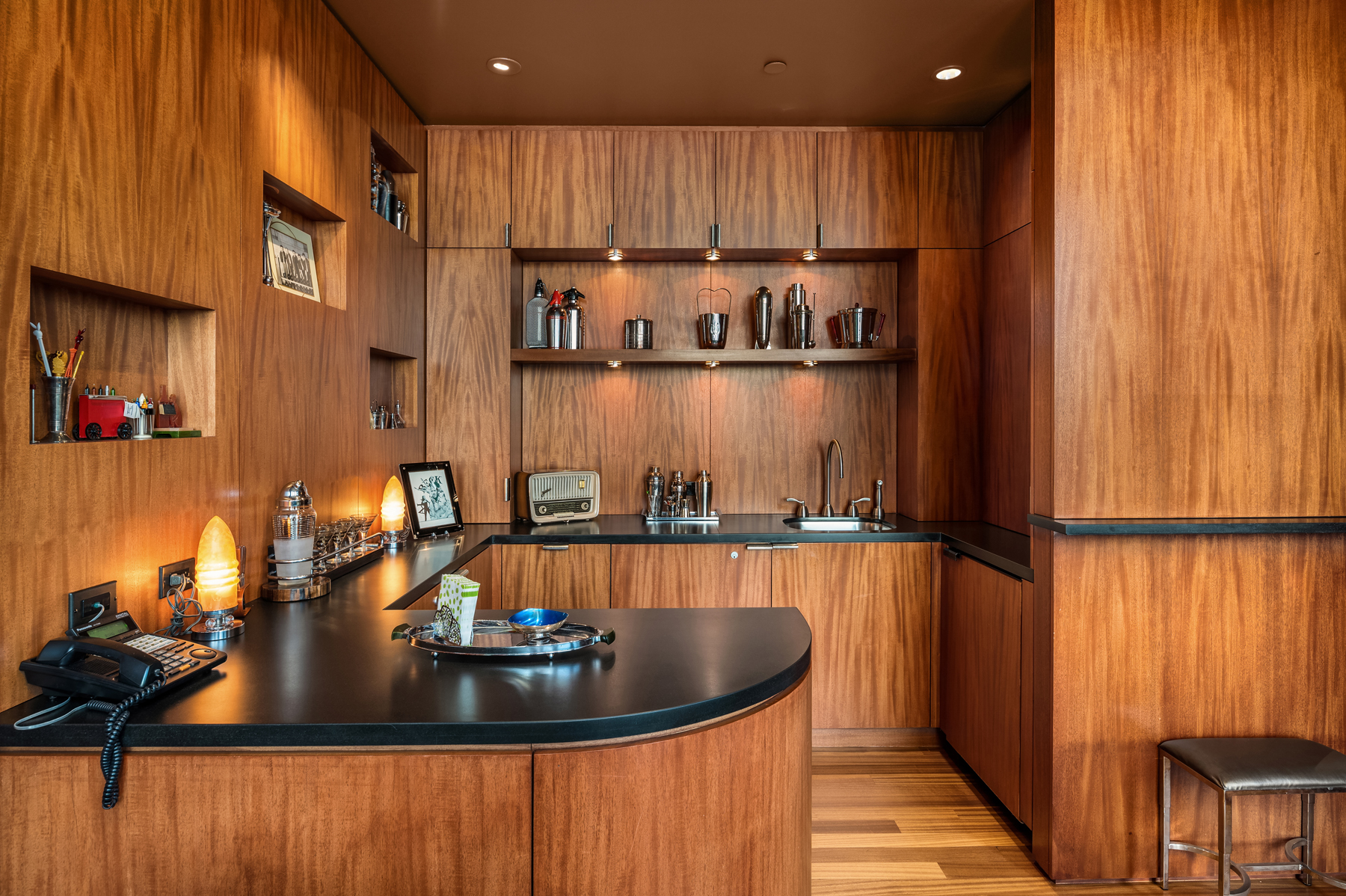 Book-matched mahogany interior with curved bar
